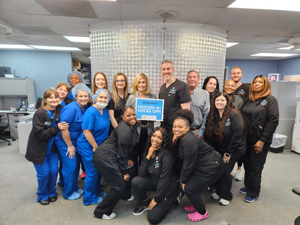 happy patient with mcfarland eye care employees