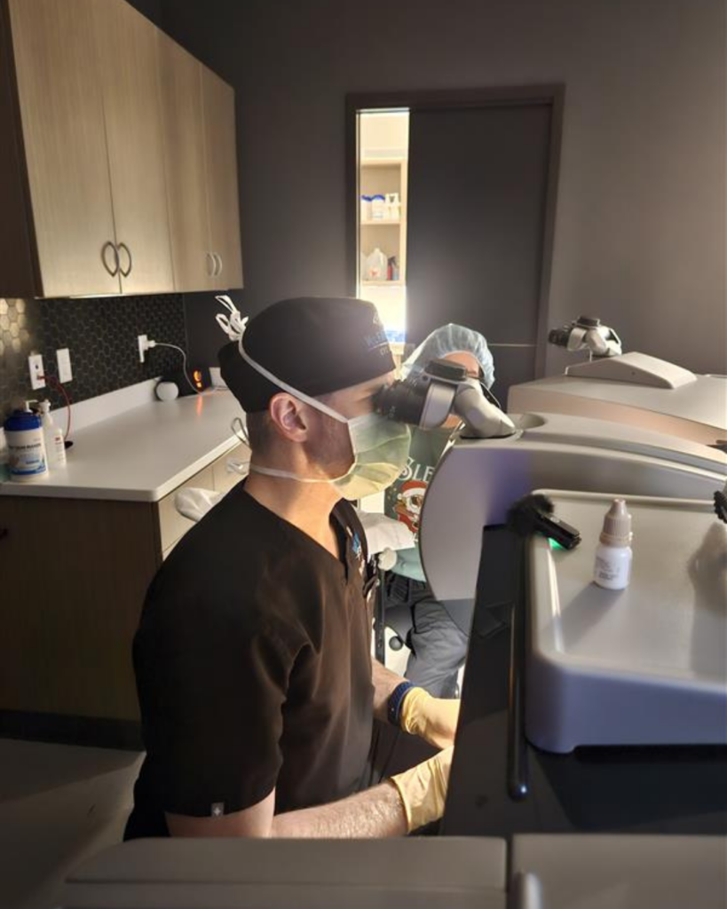 LASIK surgeon performing laser vision correction surgery at McFarland Eye Care in Arkansas, using advanced ophthalmic technology to help patients reduce their dependence on glasses and contact lenses.