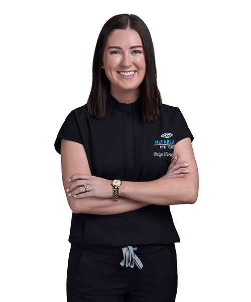 Dr. Harvey, dry eye specialist at McFarland Eye Care, smiling with arms crossed in professional medical attire.