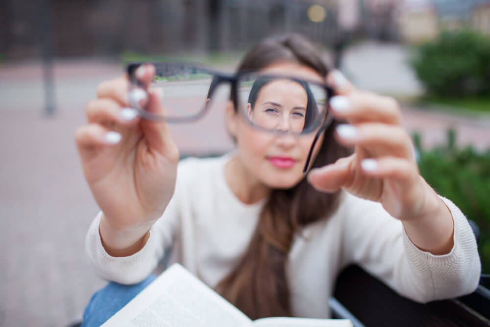 Woman looking through glasses